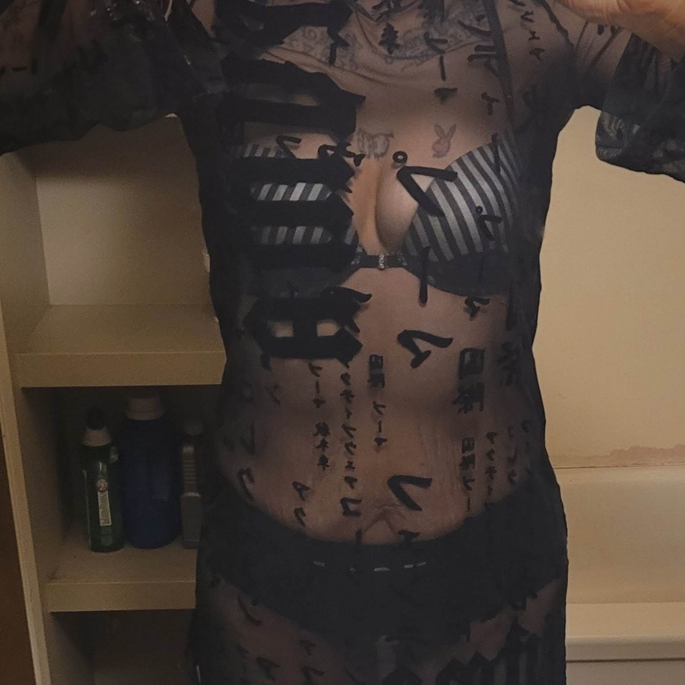 This is the brand fenty,it's a black see-through Aisan style puma dress it's a M